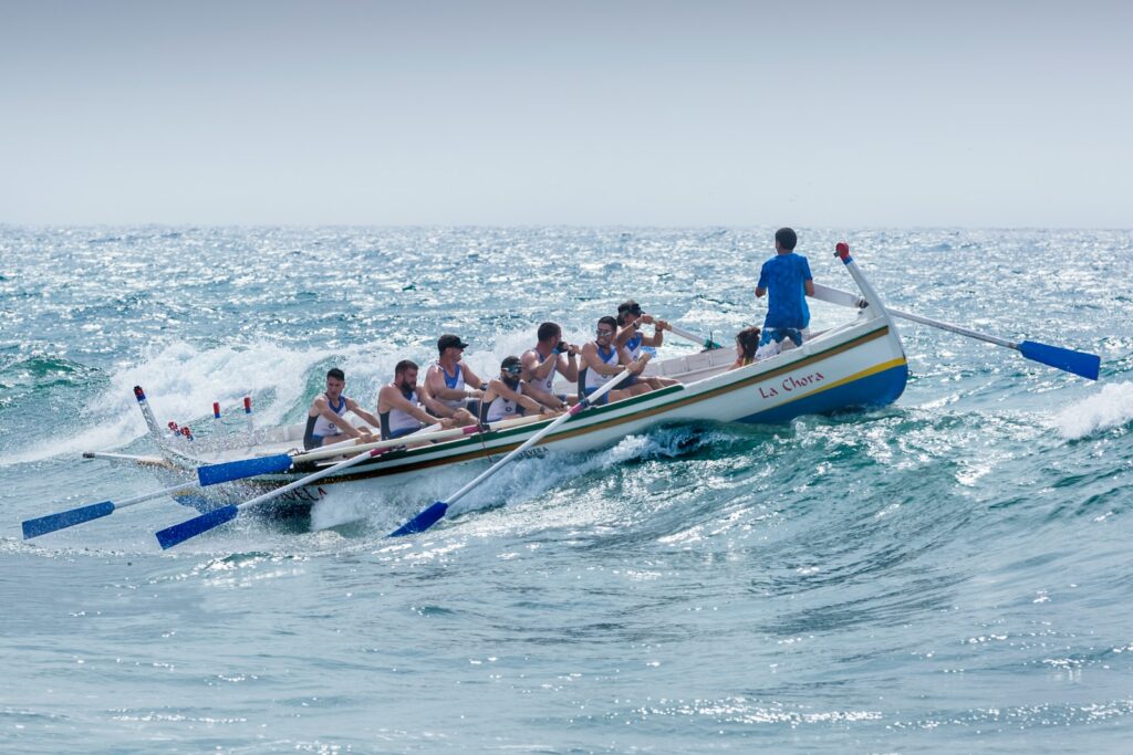 group of men riding boat